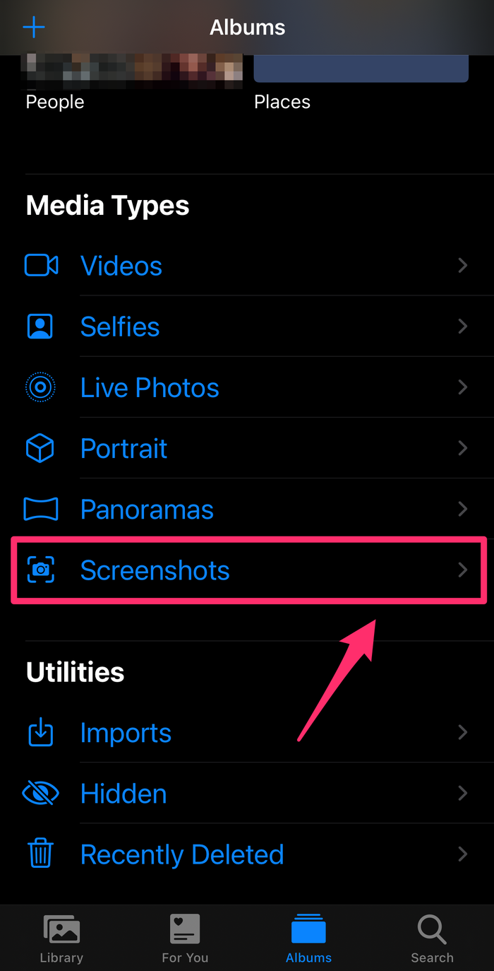 iPhone screenshot of the Photos app with the Screenshots option highlighted